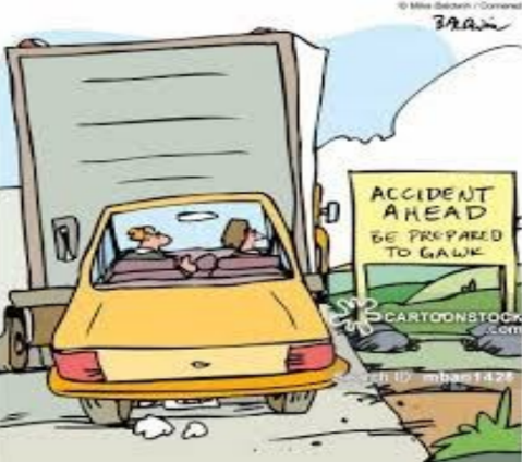 A cartoon of a traffic jam with a sign saying 'Accident Ahead. Be Prepared to Gawk.