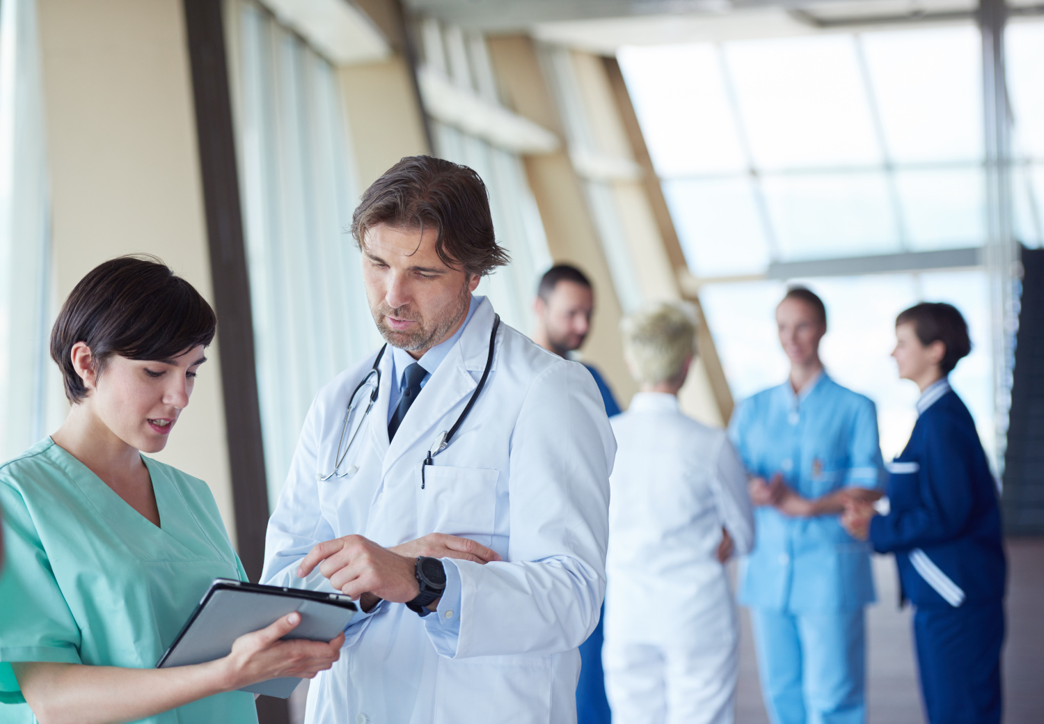 Doctor Helping Nurse in Hospital