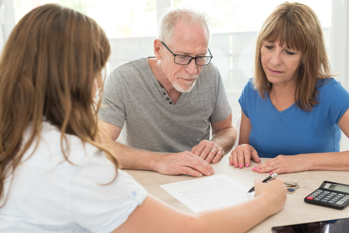 Elderly Couple Consulting with Doctor